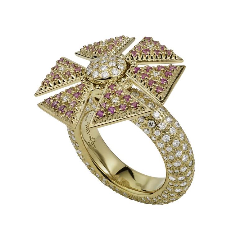 The Misahara Unity flower ring in yellow gold, set with pink sapphires and white diamonds. From the Sahara collection, the design enables the ring to spin.